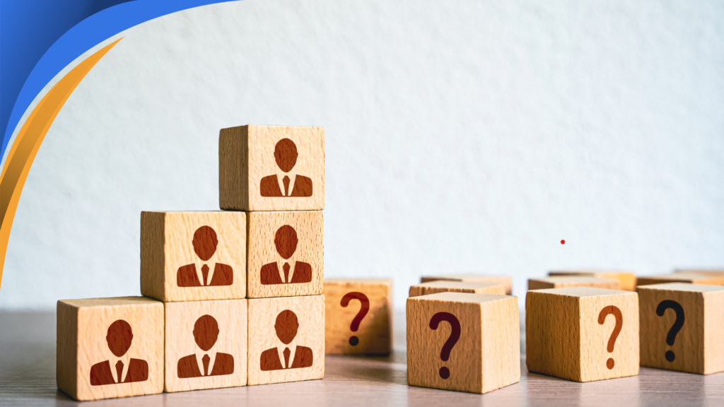 Wooden blocks with candidate icons next to blocks with question marks, representing recruiting choices