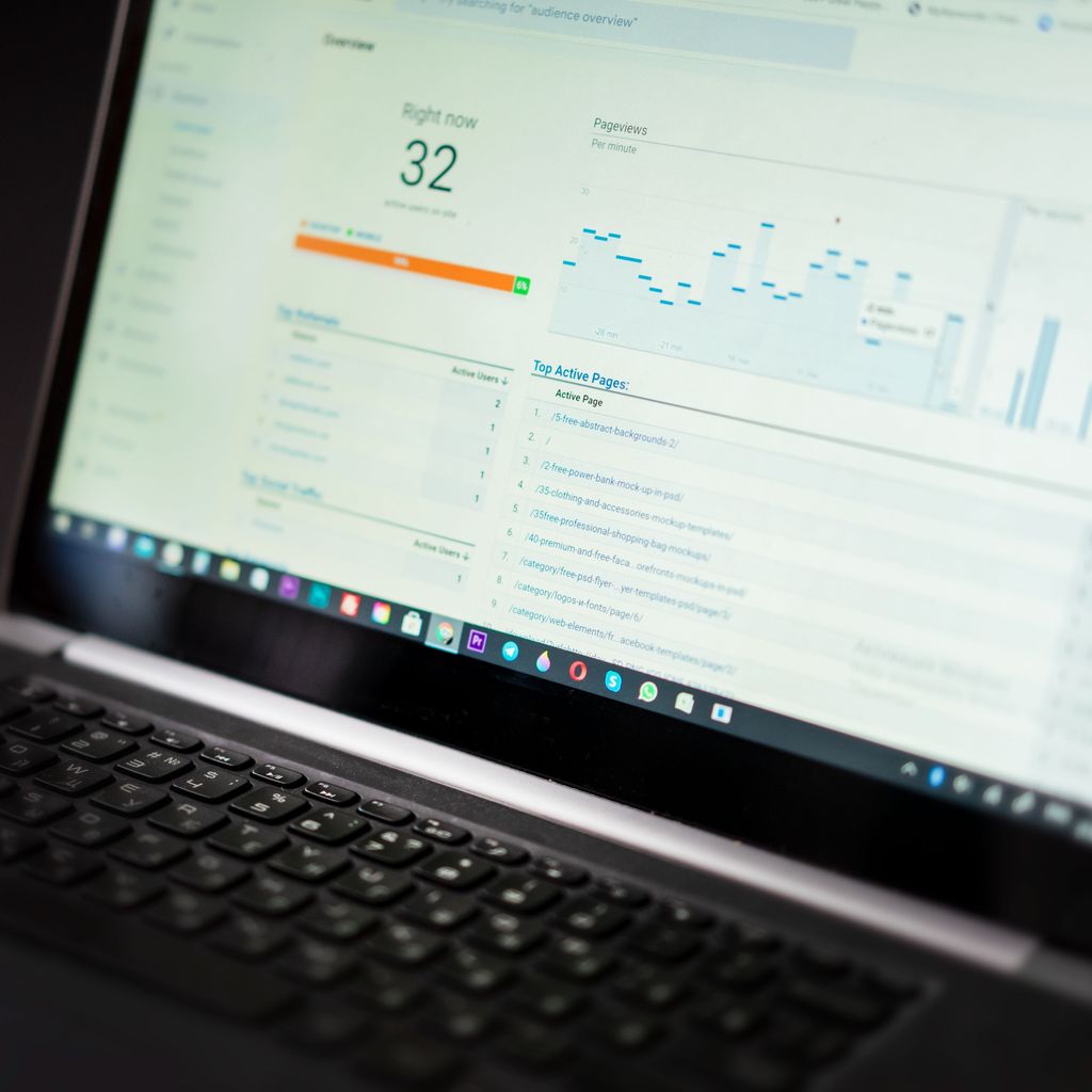 A laptop showing a website traffic dashboard