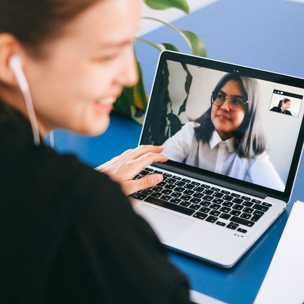 A customer success manager on a video call with a client