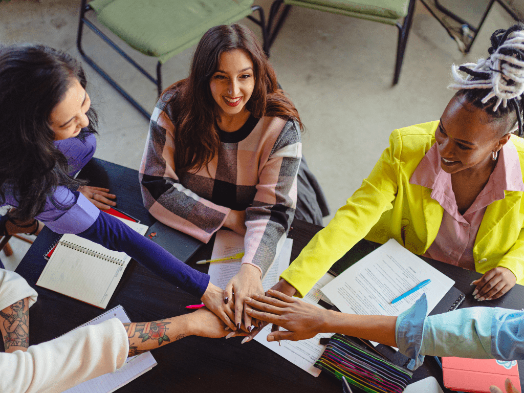A group of people from different countries and cultures working together in a virtual office, with hiring practices, communication and collaboration tools, and employee engagement and retention