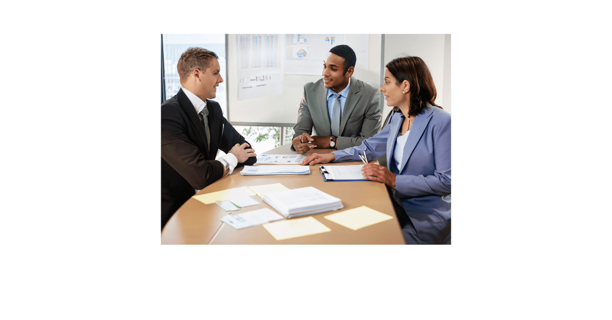 A sales team discussing the sales process in a meeting