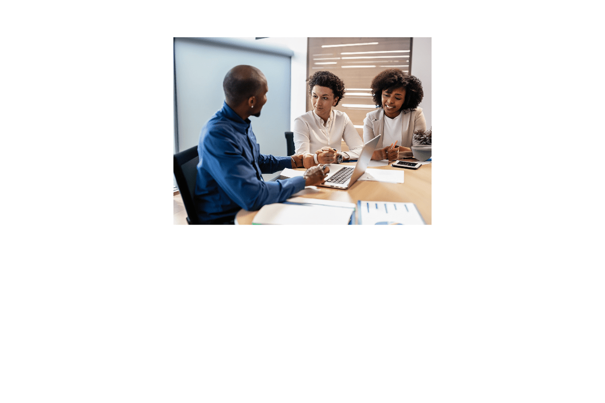 A group of sales development representatives from an outsourced SDR team working together in an office