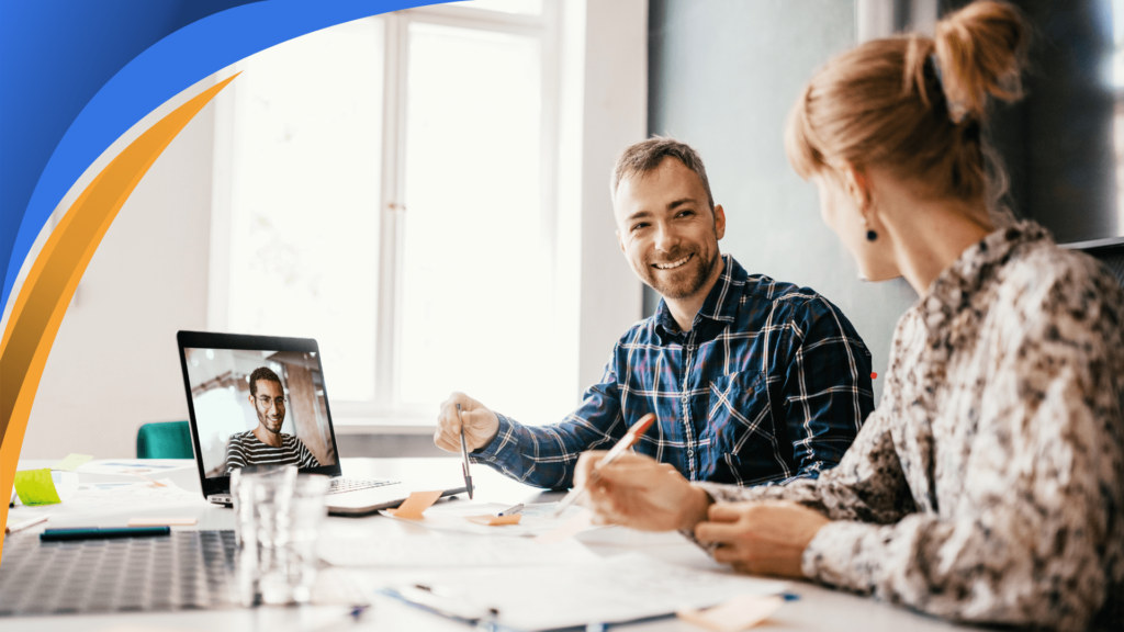 In-office sales team meeting with a remote colleague on a laptop video call