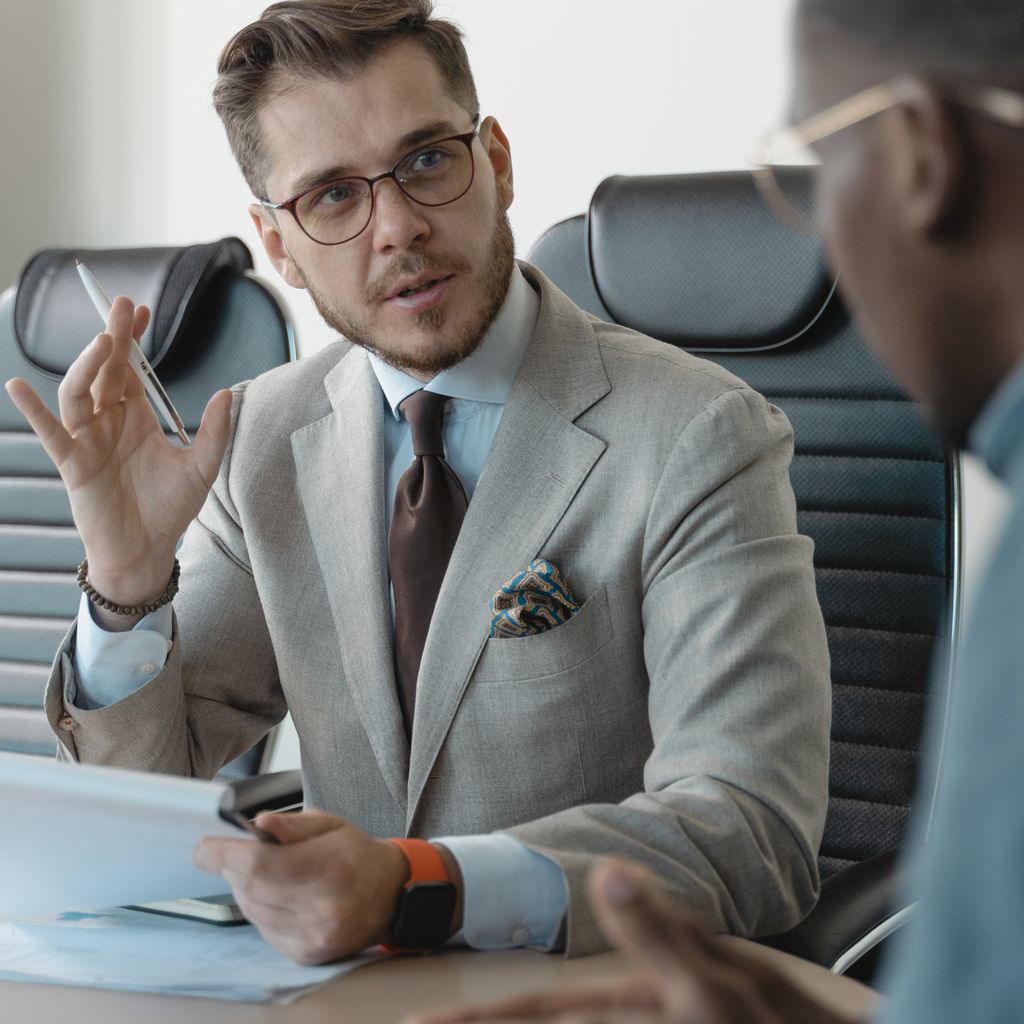 A recruiter interviewing a candidate across a meeting table