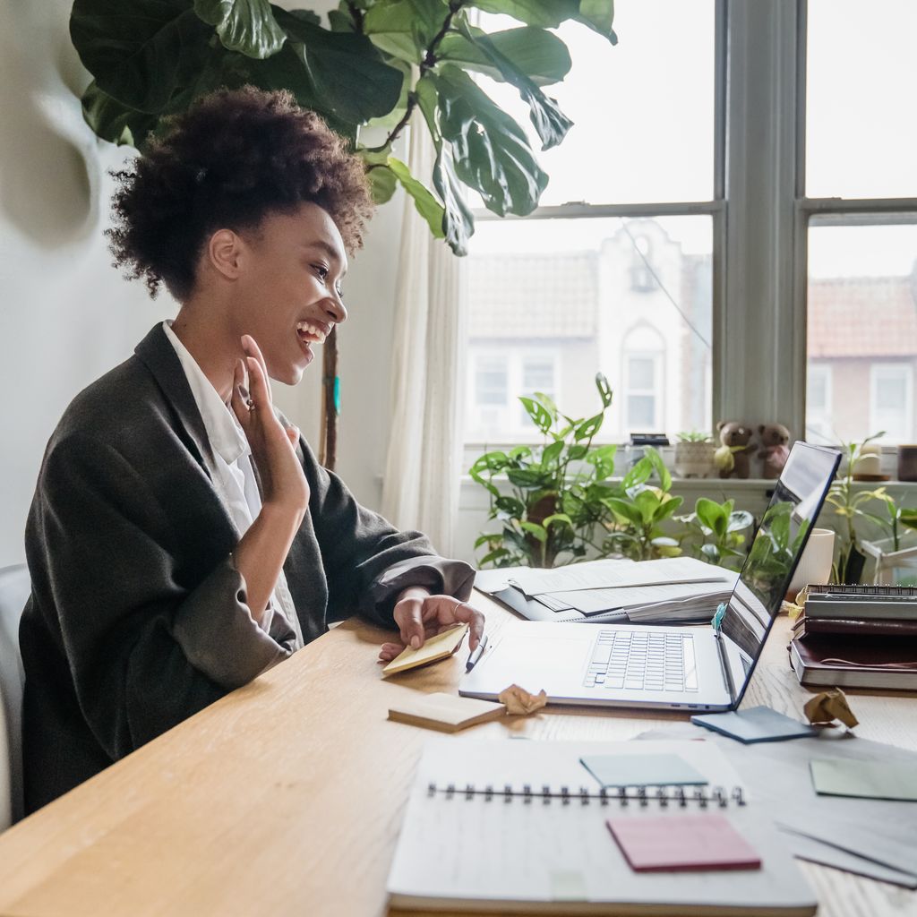 An onboarding specialist welcoming a new customer on a video call