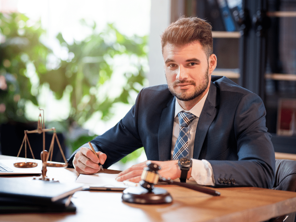 Image depicting an attorney with several drafts of a contract