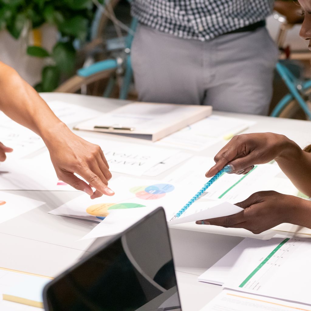 A marketing team reviewing campaign charts together