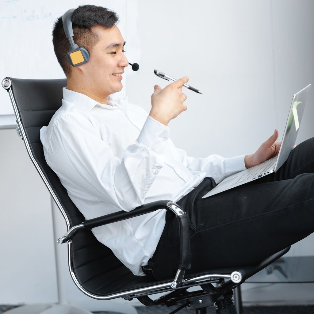 A sales development rep on a call at his desk