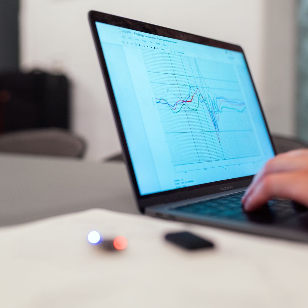 A person working on a graph on a laptop
